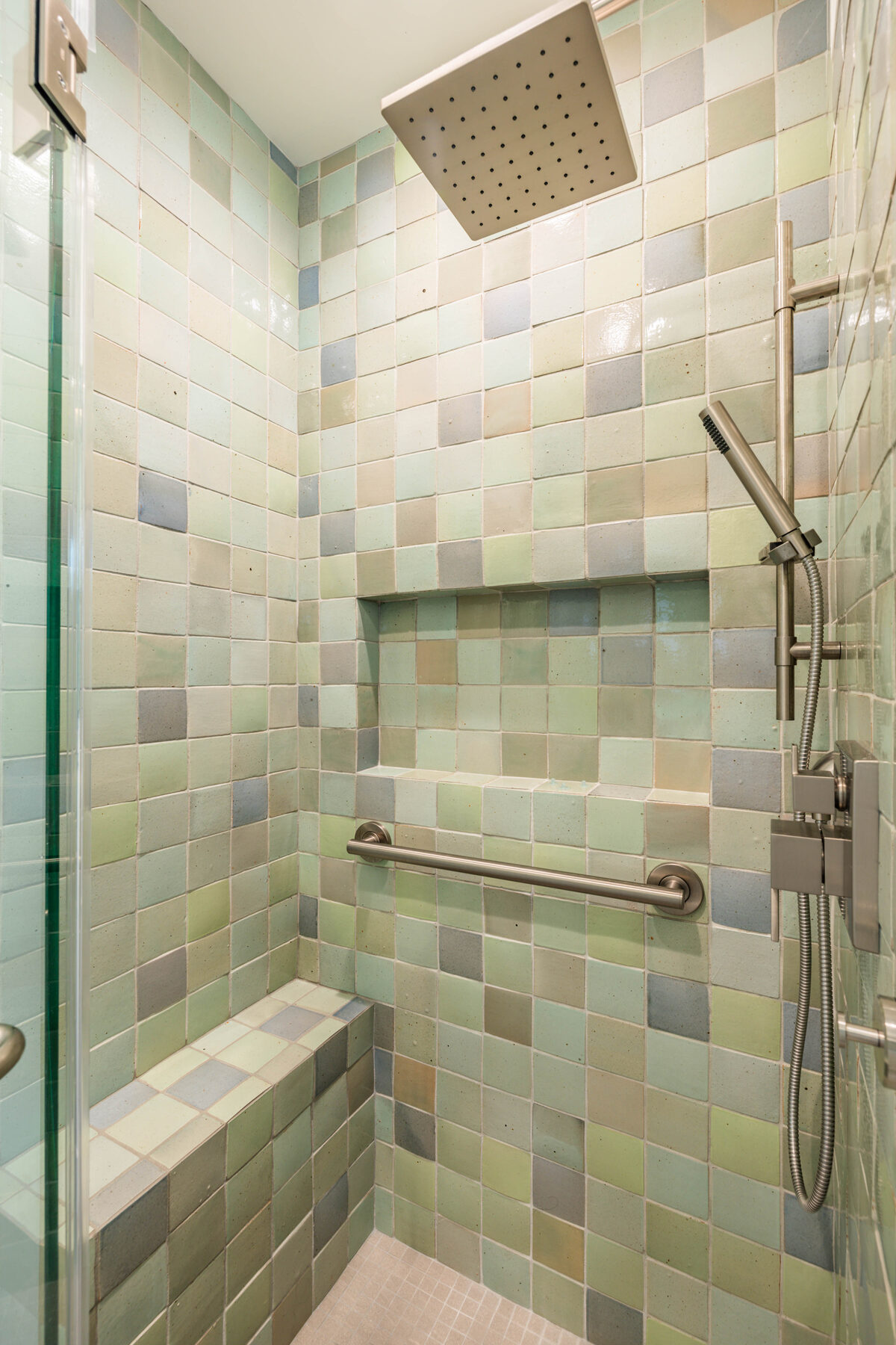 Shower with hand-glazed variegated mosaic tile in celadon and cornflower